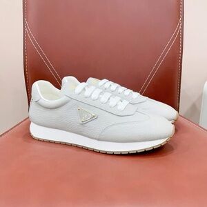 White Low-Top Sneakers with Textured Material and Thick Sole